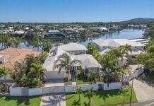 Luxury waterfront residence with picturesque backdrop