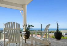 At the highpoint of prized beachside street